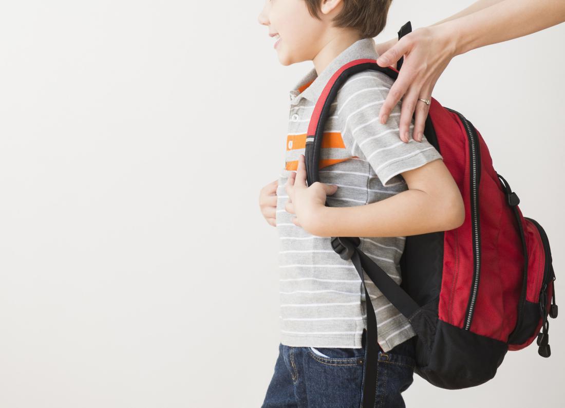 Hispanic mother rushing son to school